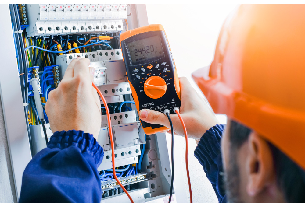 Electrician installing electric cable