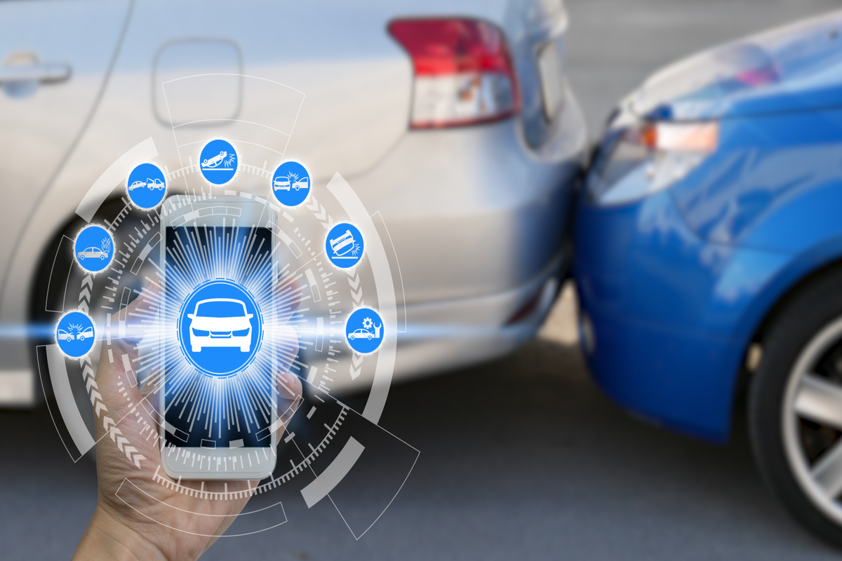 Hand use smartphone with car claim icons over the Network connection on car crash background, car accident for car insuranc claim concept