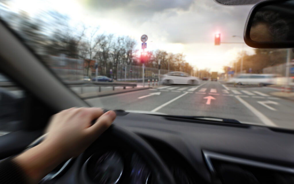 Hard braking in a car before an intersection on red light