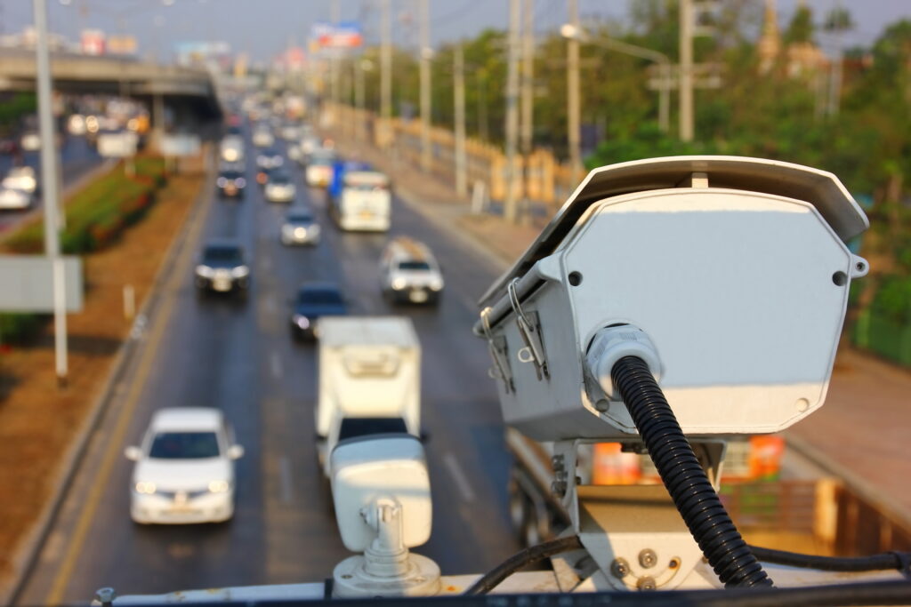 Traffic CCTV camera monitoring vehicles on a highway